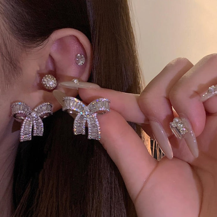 Delicate bow sparkling diamond earrings