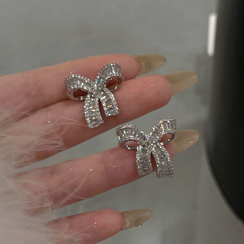 Delicate bow sparkling diamond earrings