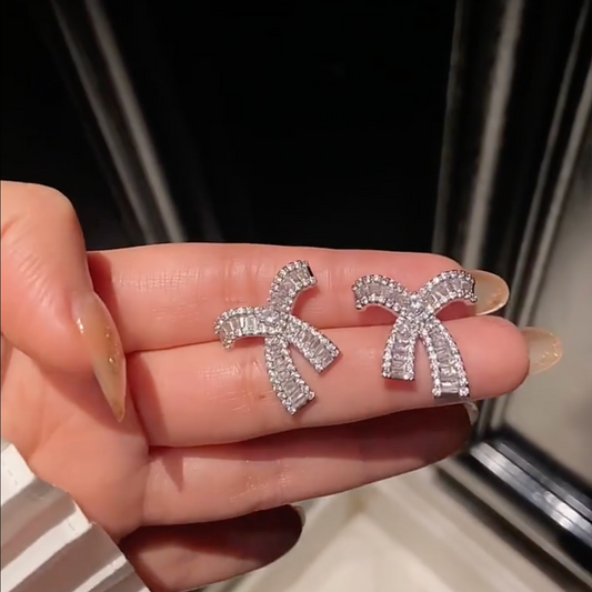 Delicate bow sparkling diamond earrings